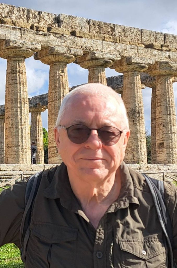 Headshot of the author before the Temple of Hera in Paestum, Italy